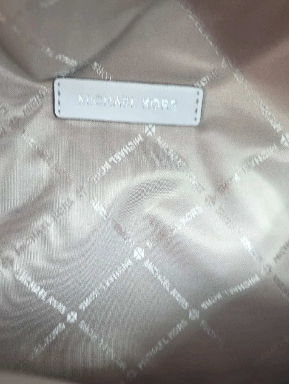 Michael Kors Slater Medium Rainbow Logo Embossed Sling Pack in Optic White